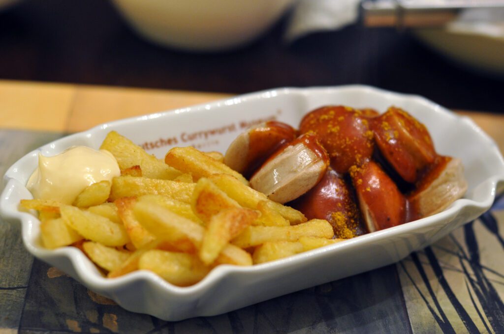Currywurst in Berlin: A taste of the city - a portion of currywurst and fries