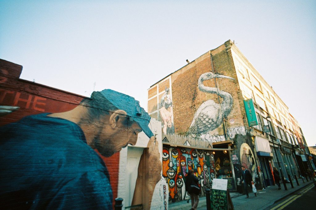 Colorful street art and murals in Shoreditch, London, with a giant heron