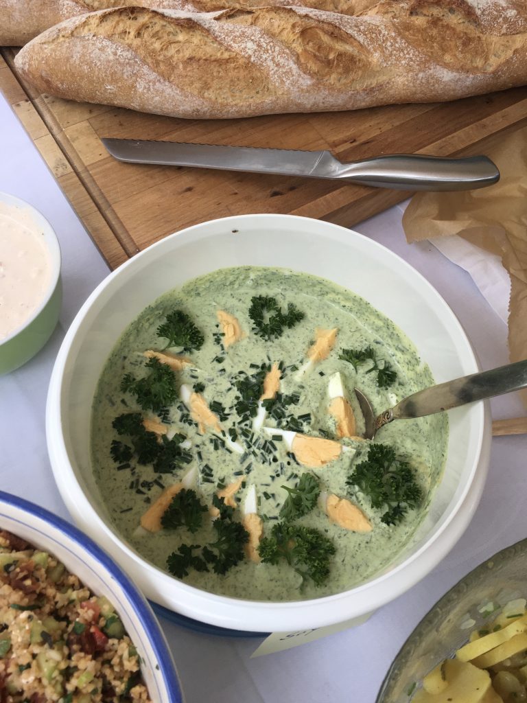 Frankfurt food guide: Bowl of green herb sauce with chopped eggs and parsley on top