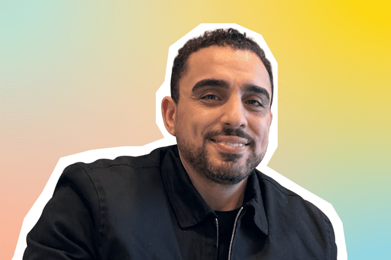 Portrait of Mohammed, Cluster Hotel Manager on a colourful background