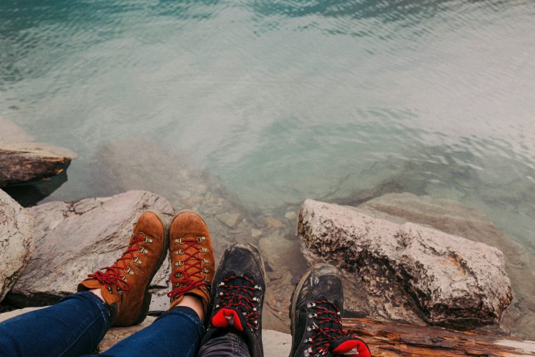 SEO-Optimized Alt Tag (Informal English, max 80 characters):
Hiking boots by a clear alpine lake