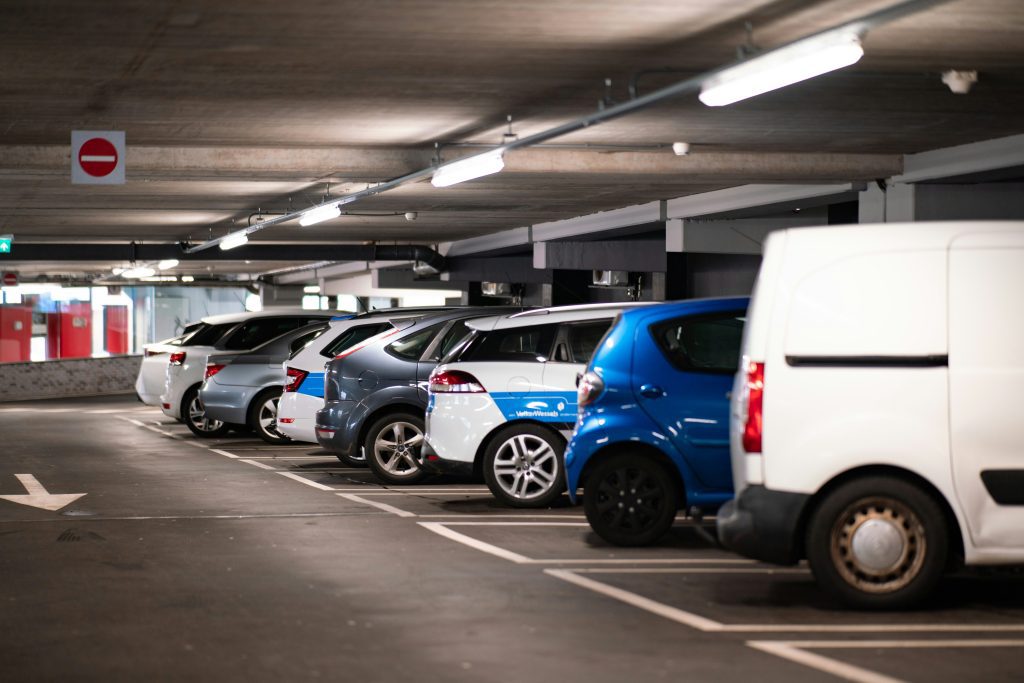 Underground parking garage with cars parked side by side