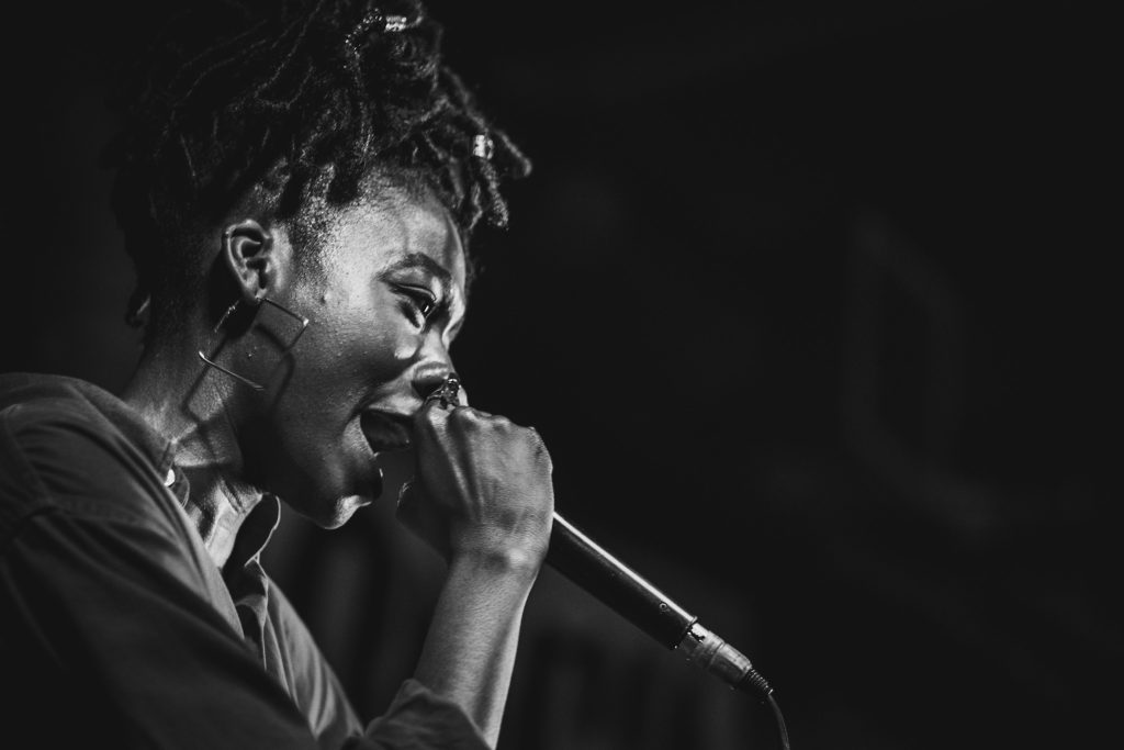 Concerts in Paris: Singer vibing on stage with mic in hand