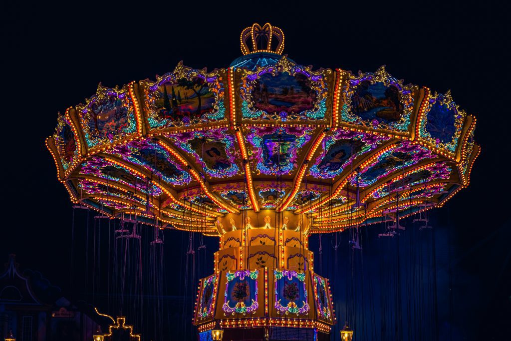 Freimarkt Bremen: Colorful swing carousel lit up at night 