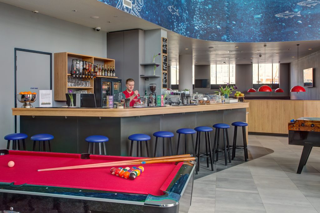 MEININGER Hotel Amsterdam Amstel hotel bar with pool table and stools