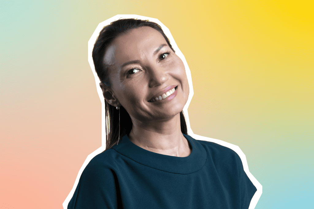 Portrait of Zhanar, Talent Acquisition & Development Manager, on a colourful background