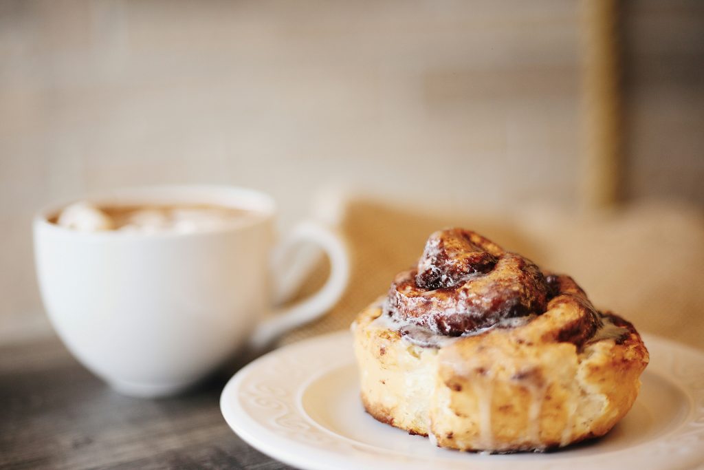 Cinnamon roll with coffee from a bakery in Copenhagen
