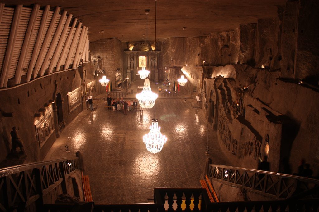 Trips to salt mines Krakow: Underground chapel with chandeliers 
