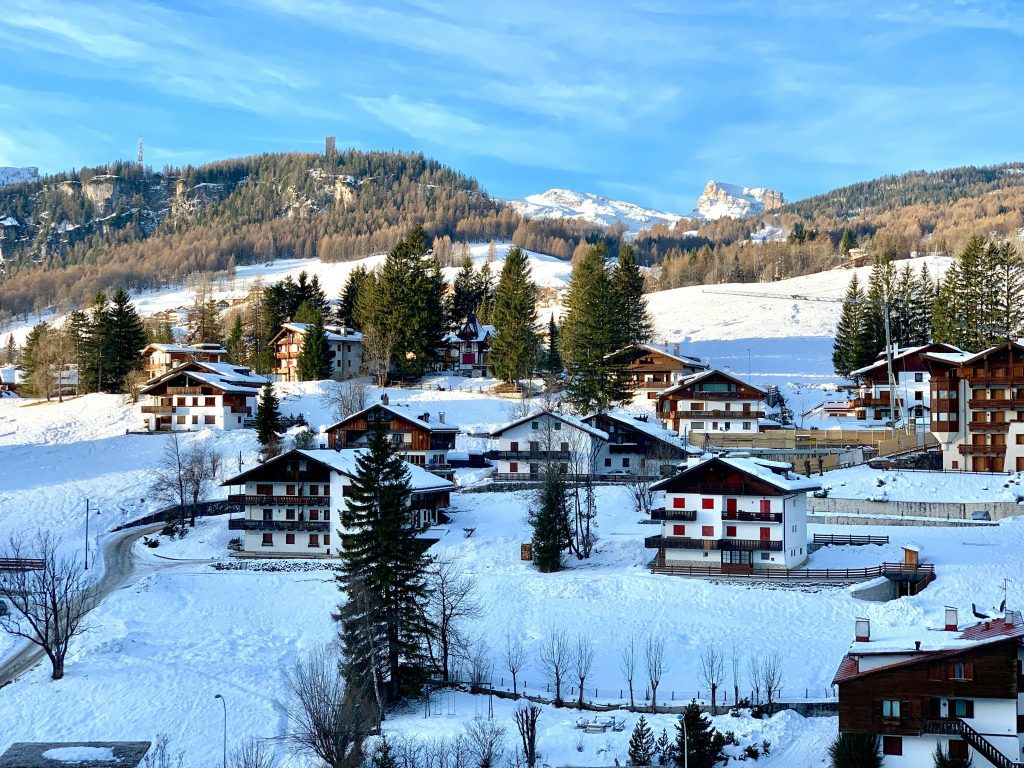 Winter olympics Italy: Snowy village of Cortina d’Ampezzo with alpine houses and mountain views