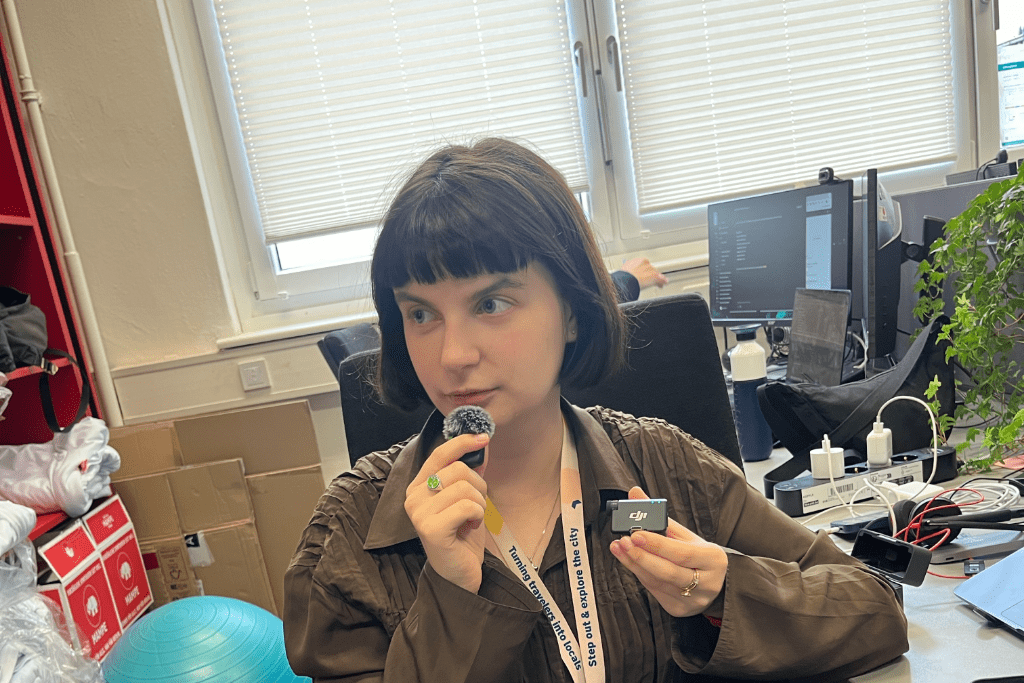Anna testing a microphone at the office