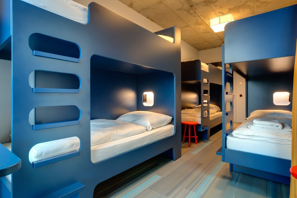 Dormitory with blue wooden bunk bed