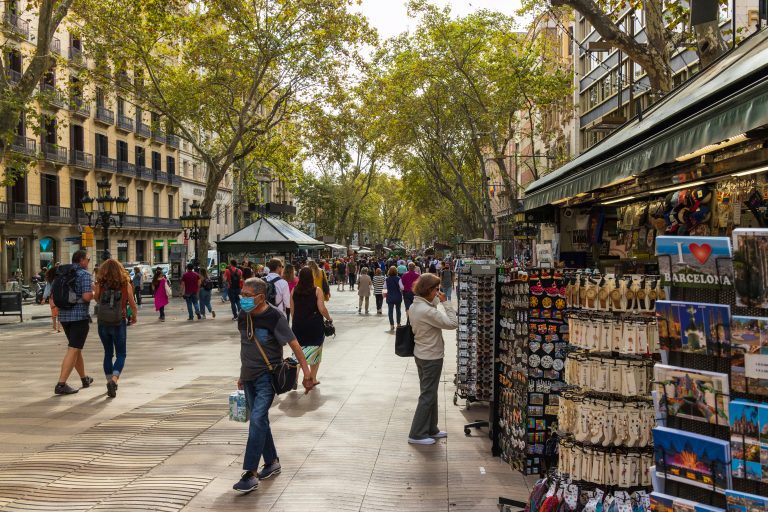 Tourist browsing souvenirs on street shops in Barcelona