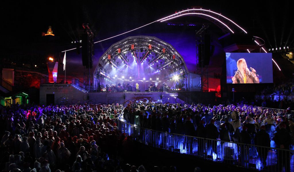 Helene Fischer tour 2026: Helene Fischer live show with huge stage lights and crowd
