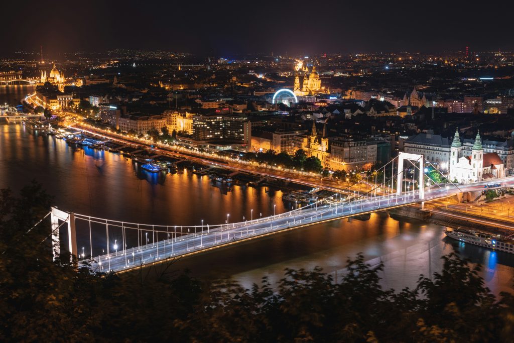 Budapest nightlife: Budapest at night with lit bridges, the Danube and glowing city skyline