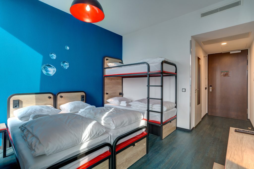 Colorful private room at MEININGER Hotels Amsterdam with bunk beds