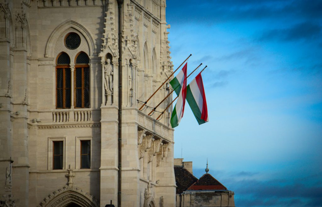 Hungary national day: Two Hungarian flags on a historic Budapest building on national day