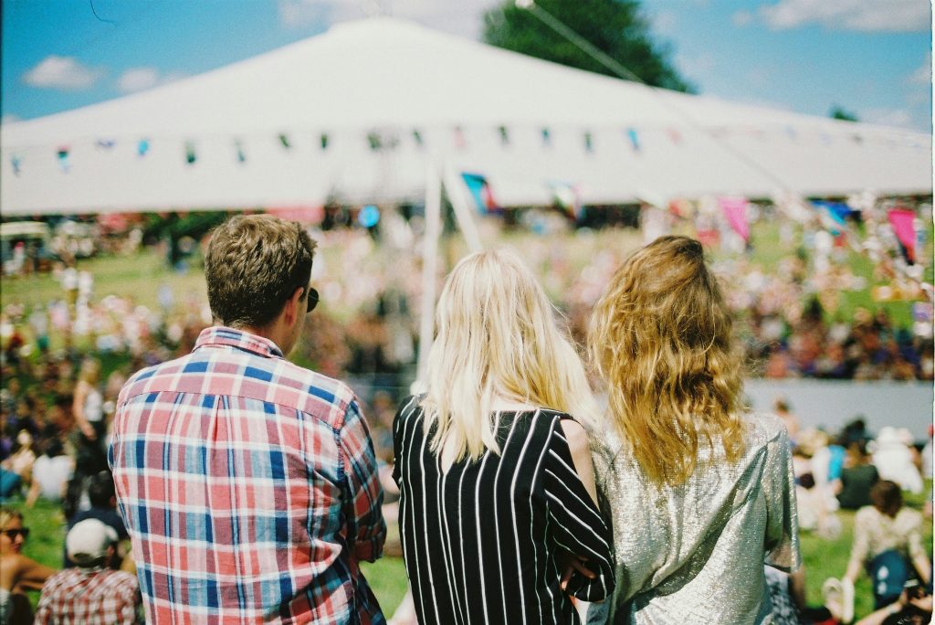 Hungary national day: Three friends watching a live stage at Sziget Festival in Budapest