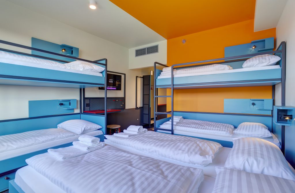 Colorful bunk bed room at MEININGER Hotel Budapest Great Market Hall