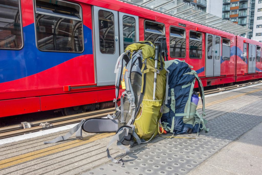 Backpacking France on a budget: Two backpacks waiting on the platform before a train ride