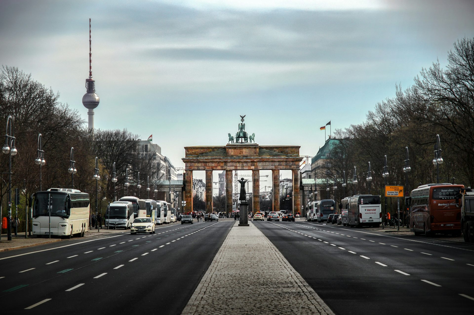 Brandenburg Tor with the TV tower on the left, Unter den Linden with buses and cars