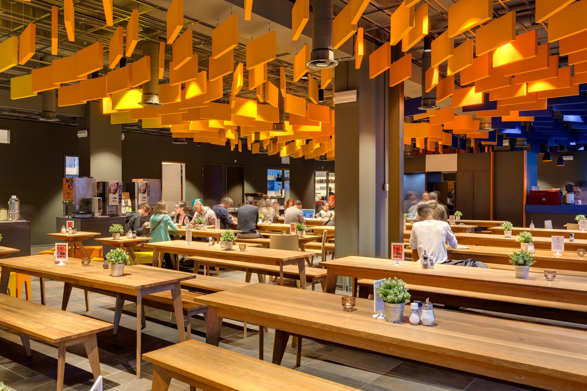 MEININGER's airy breakfast hall with long tables, ready for a fuel-up