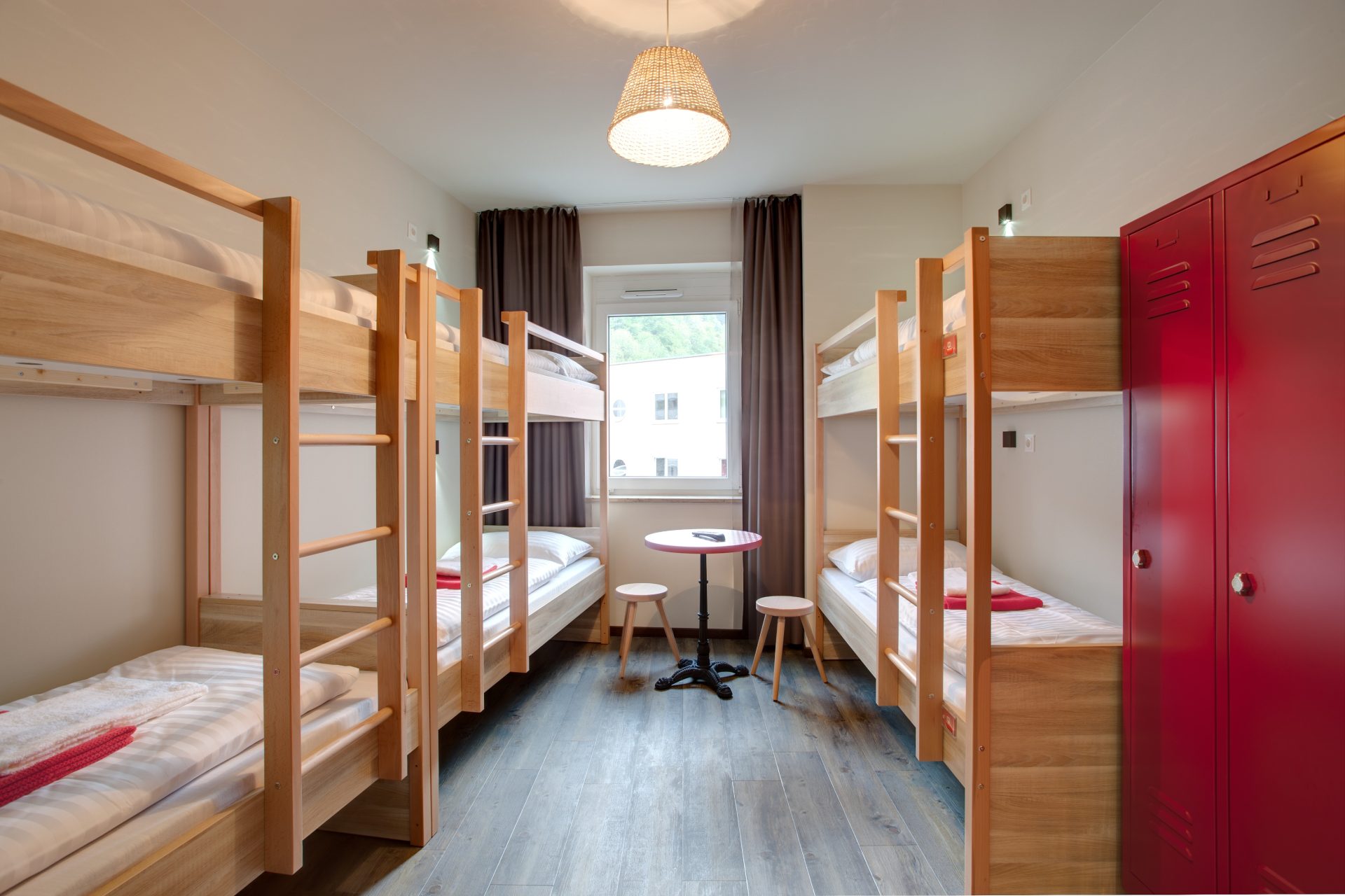 Spacious shared dorm at MEININGER Hotel Salzburg City Center with bunk beds