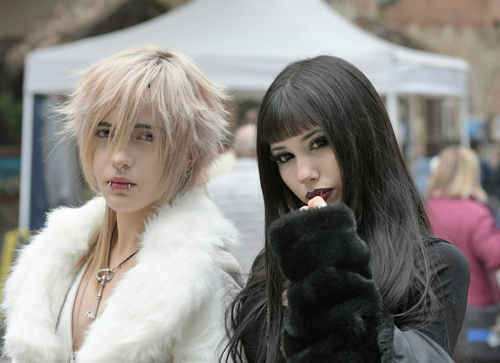 Hidden gems in Germany: Two goths in striking makeup and outfits at Leipzig's Wave-Gotik-Treffen