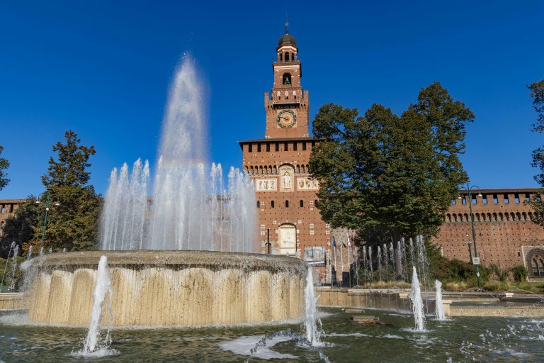 Castello Sforzesco building with a fountain on the foreground