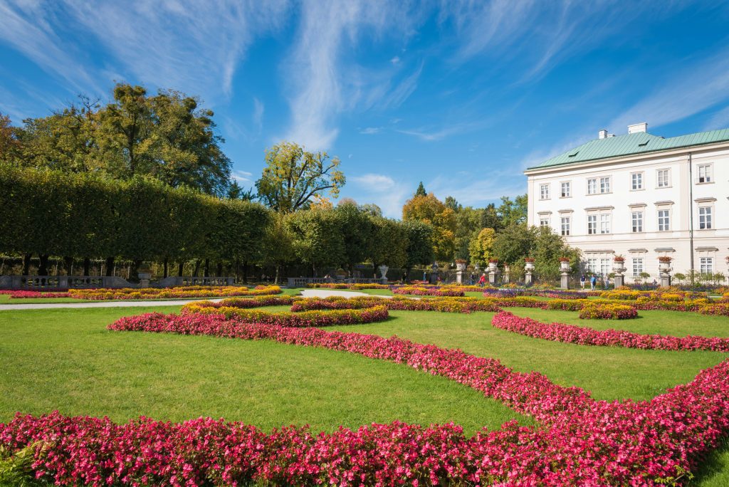 Pink flower beds at Mirabell Gardens in Salzburg, steps from Mozart Week venues