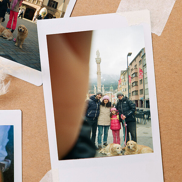 Film photo showing a family with children and 2 dogs in Innsbruck, Austria