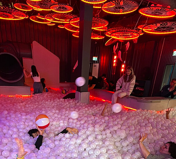 People inside a balls pool