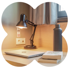 Energy-efficient lighting and reusable bottle in MEININGER Hotels room