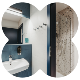 Bathroom at MEININGER Hotels with water-saving fixtures and clean design