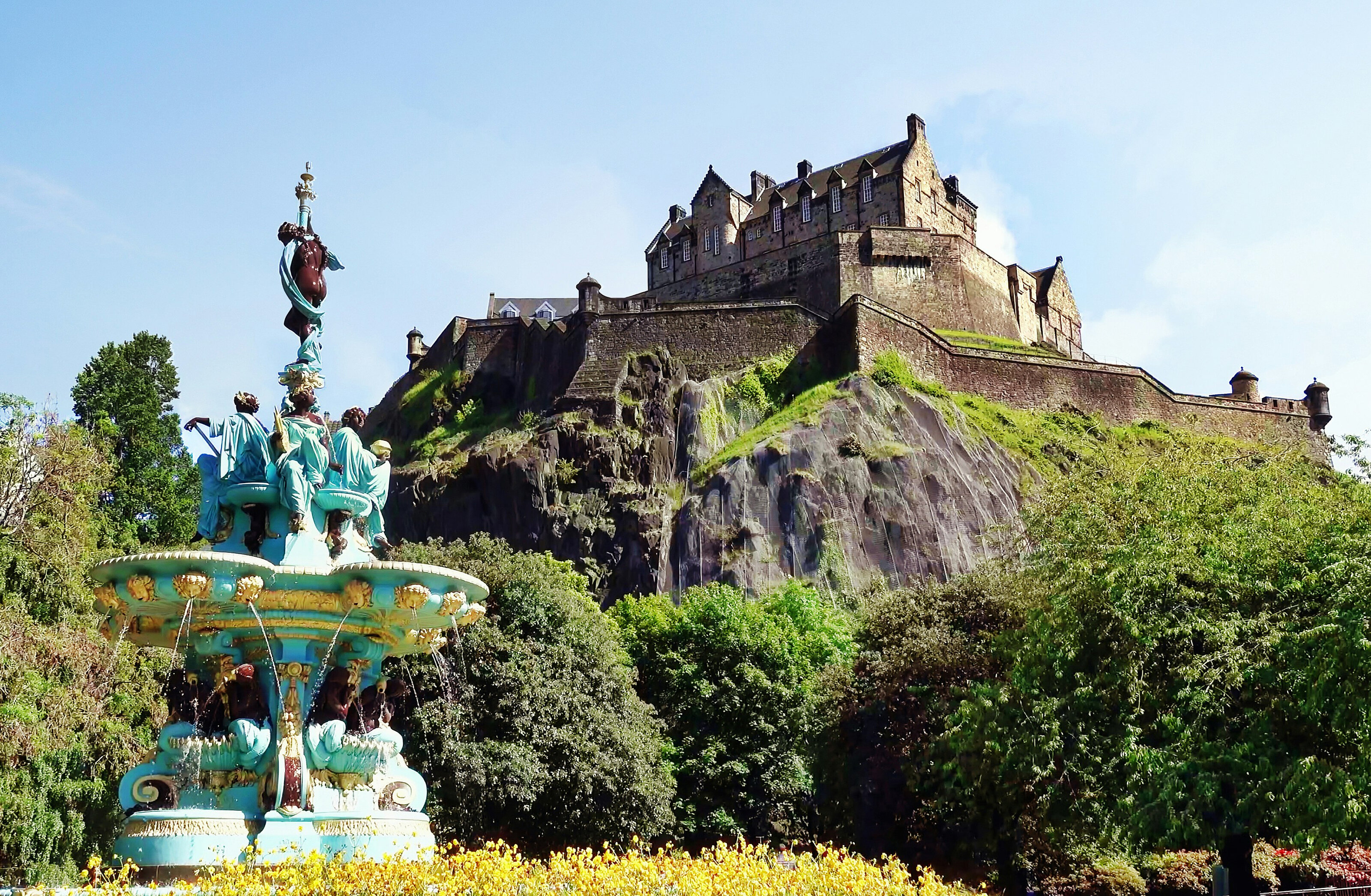 Edinburgh Castle above Ross Fountain on a sunny day