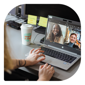 Guests on a call in a shared space at MEININGER Hotels